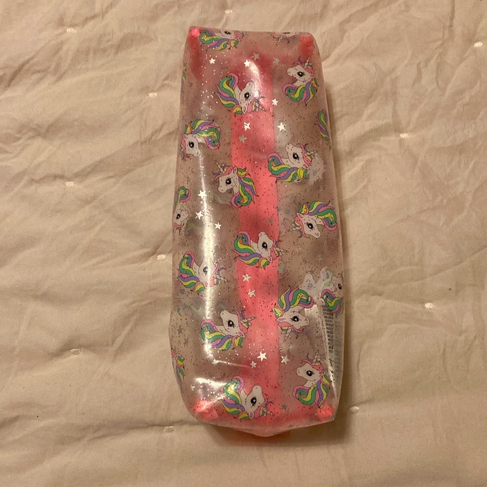A pink, white, clear unicorn pouch. From: H&M. Name: Unicorn Pouch - Picture 4 of 5